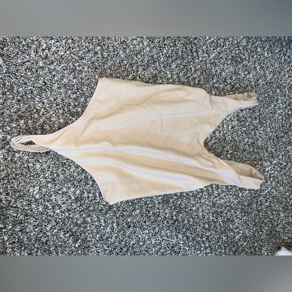 Brown body suit